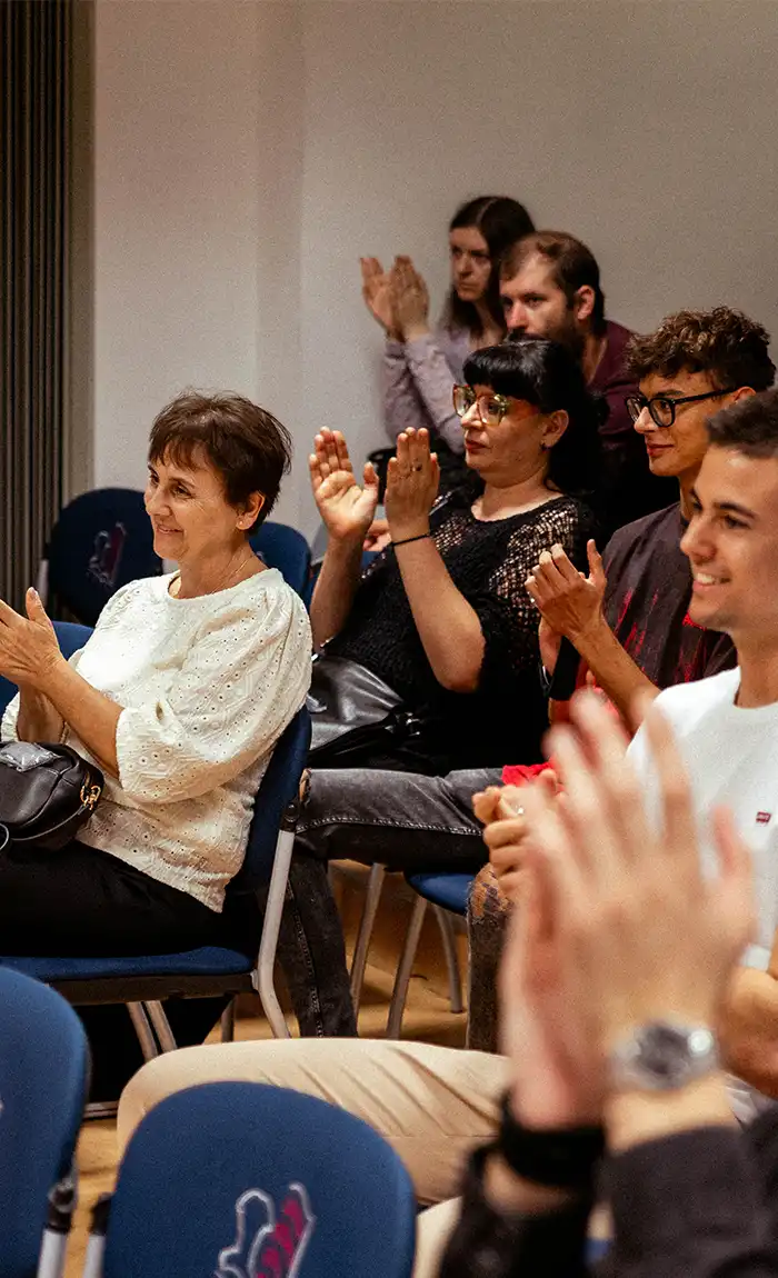  Crowd applauding at the book promotion